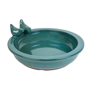 Ceramic bird bath in blue. Features two ceramic birds perched on the edge of the bath.