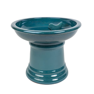 Ceramic pedestal bird bath in blue.