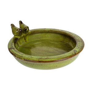 Ceramic bird bath in green. Features two ceramic birds perched on the edge of the bath.