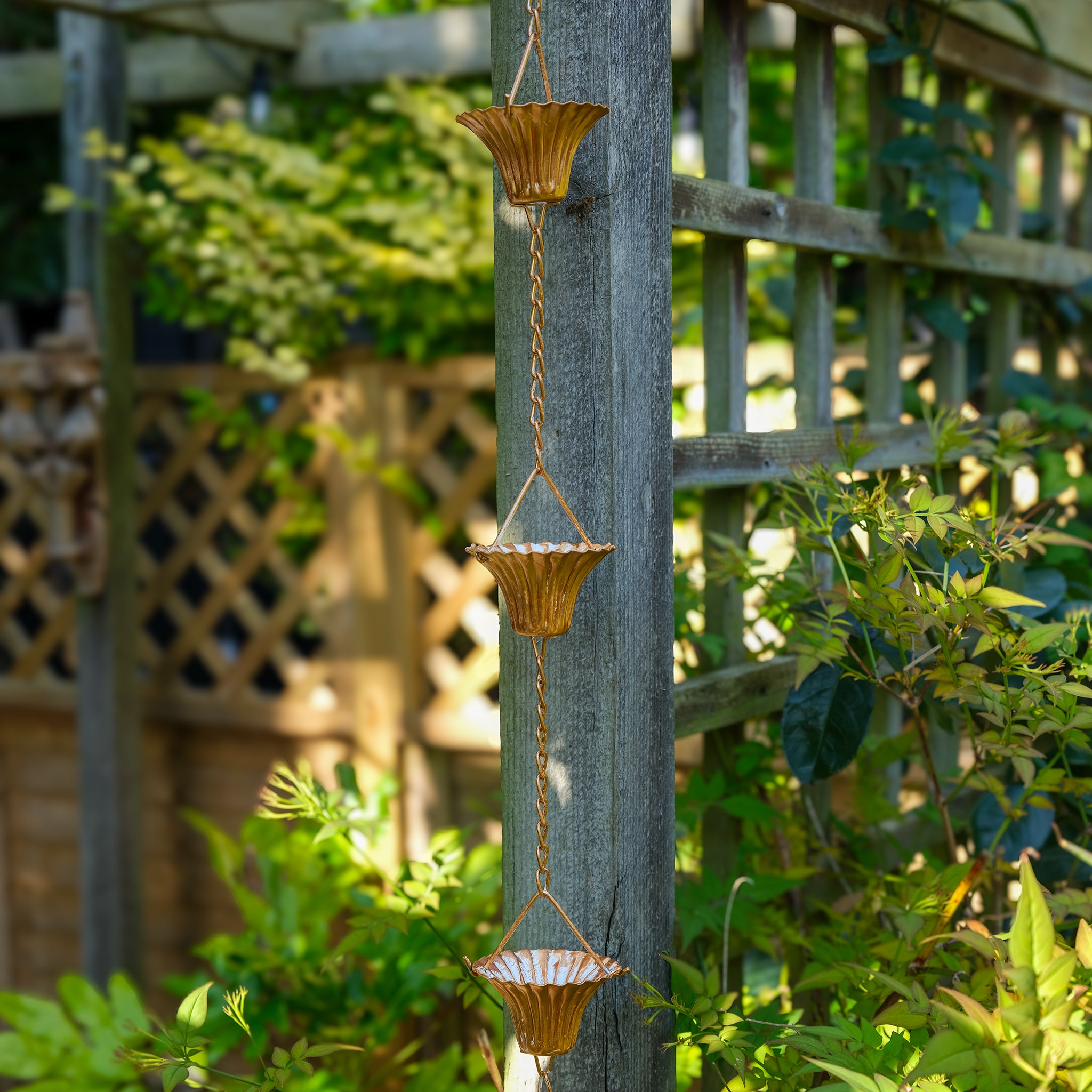 Copper plated rain chain garden ornament.