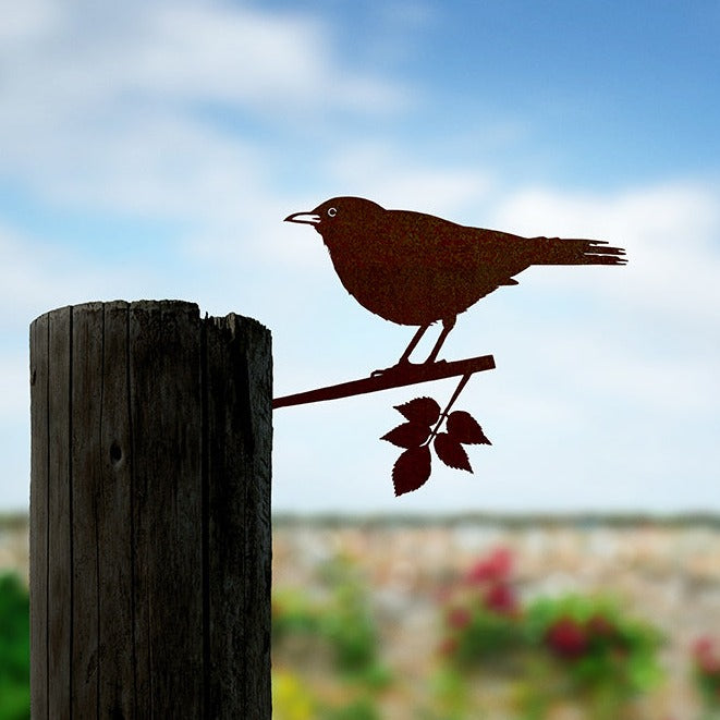 Steel metal bird silhouette and garden ornament in the shape of a blackbird.