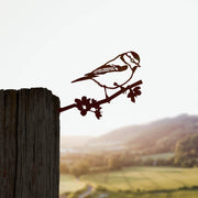 Steel metal bird silhouette and garden ornament in the shape of a blue tit.