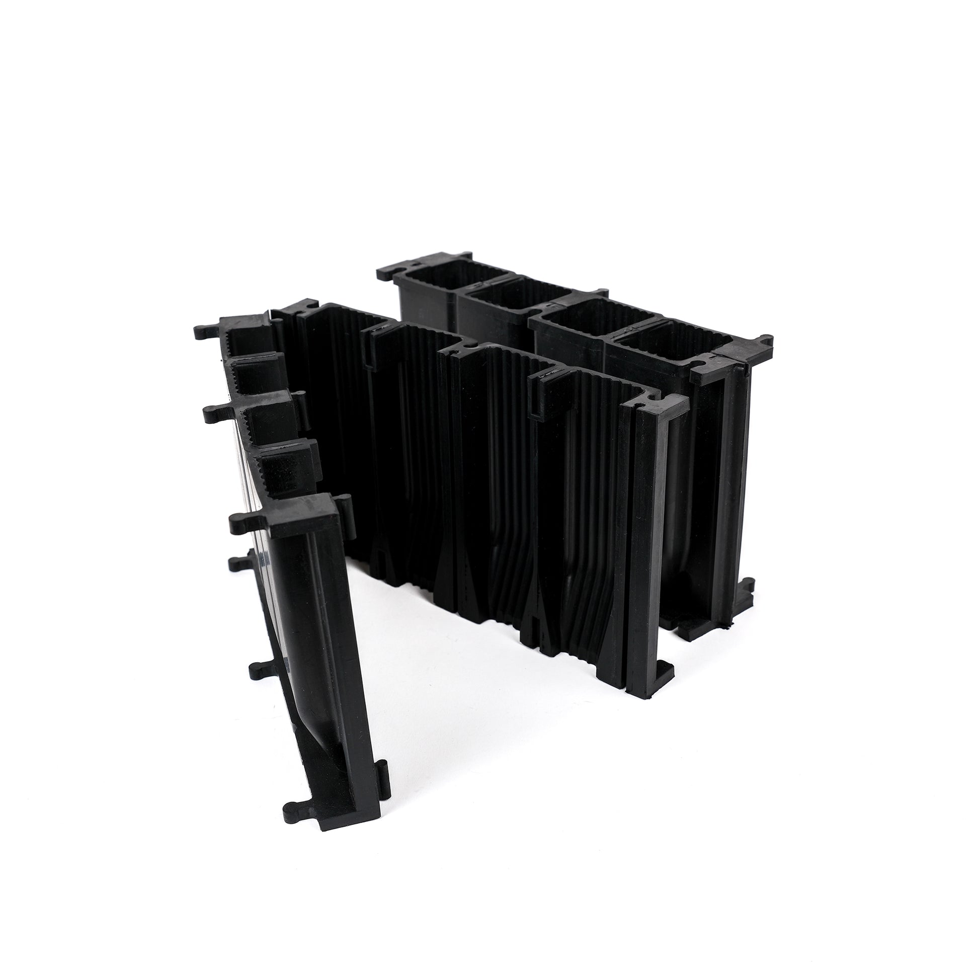 Black, plastic free, eight cell root trainer made of FSC certified, fair trade natural rubber.