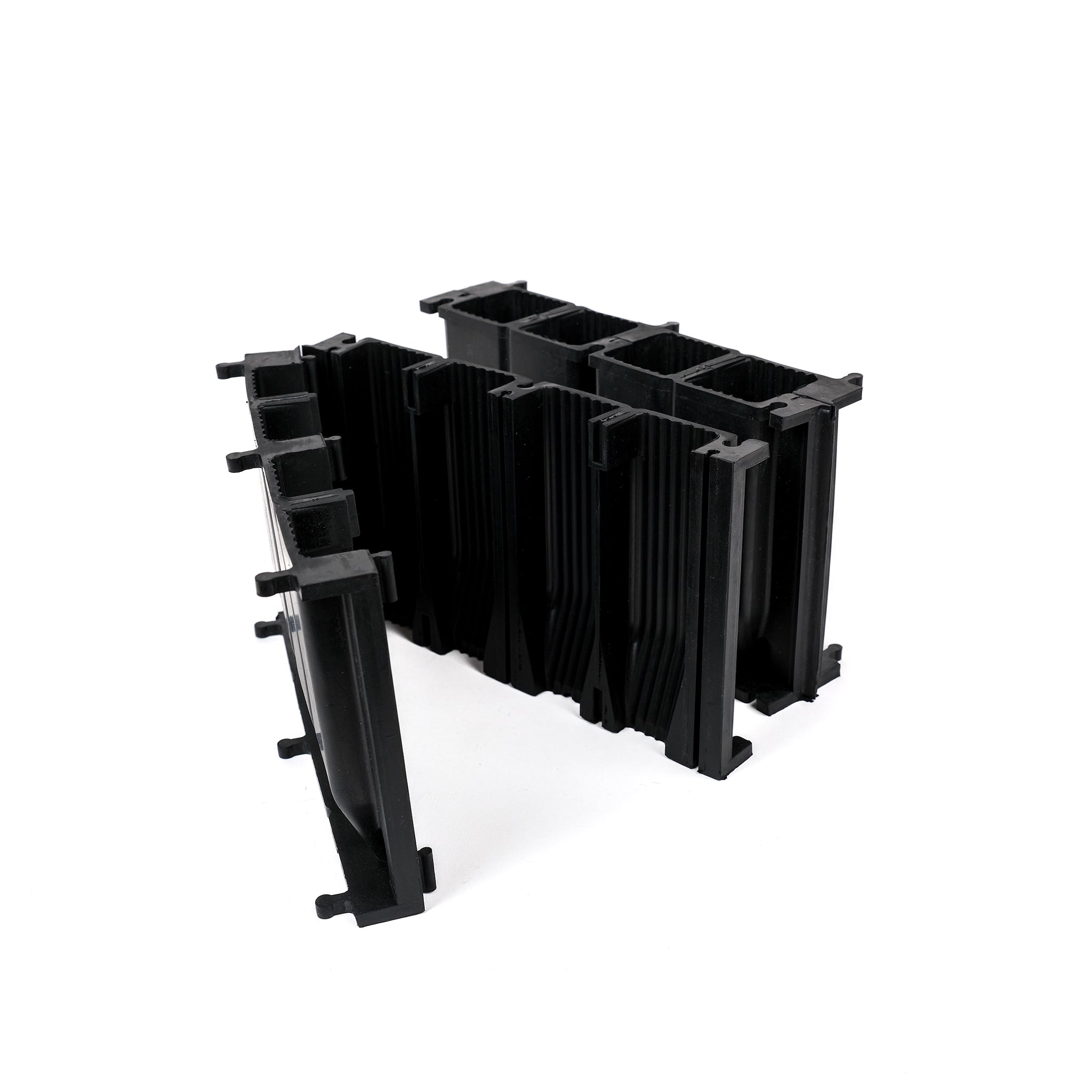 Black, plastic free, eight cell root trainer made of FSC certified, fair trade natural rubber.