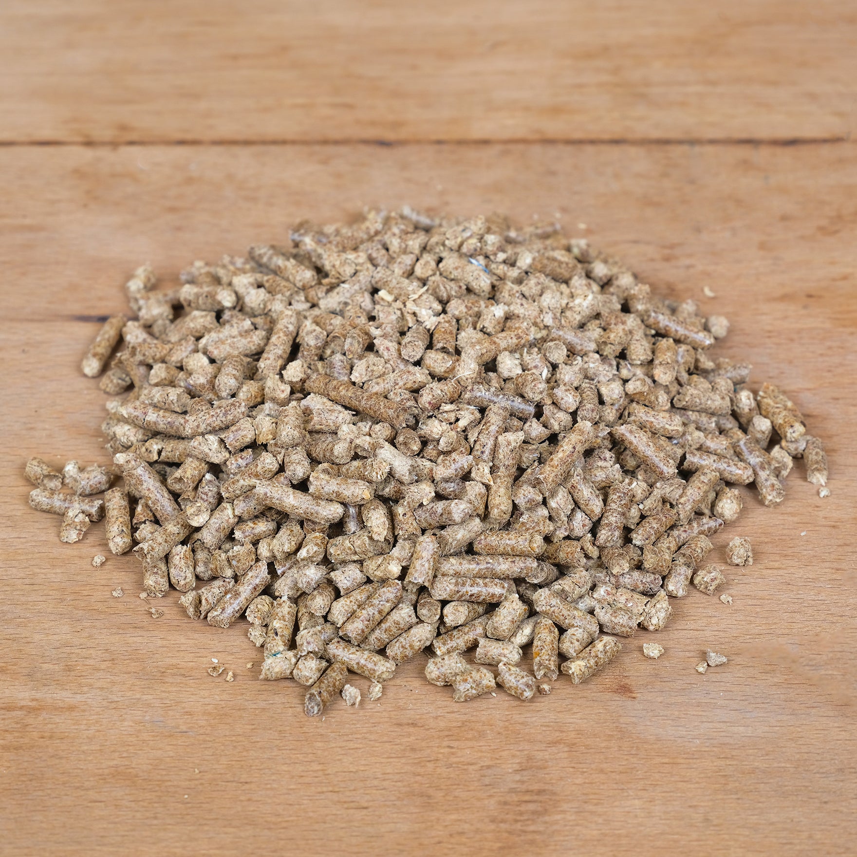 Natural wool slug and snail pellets on a potting table.