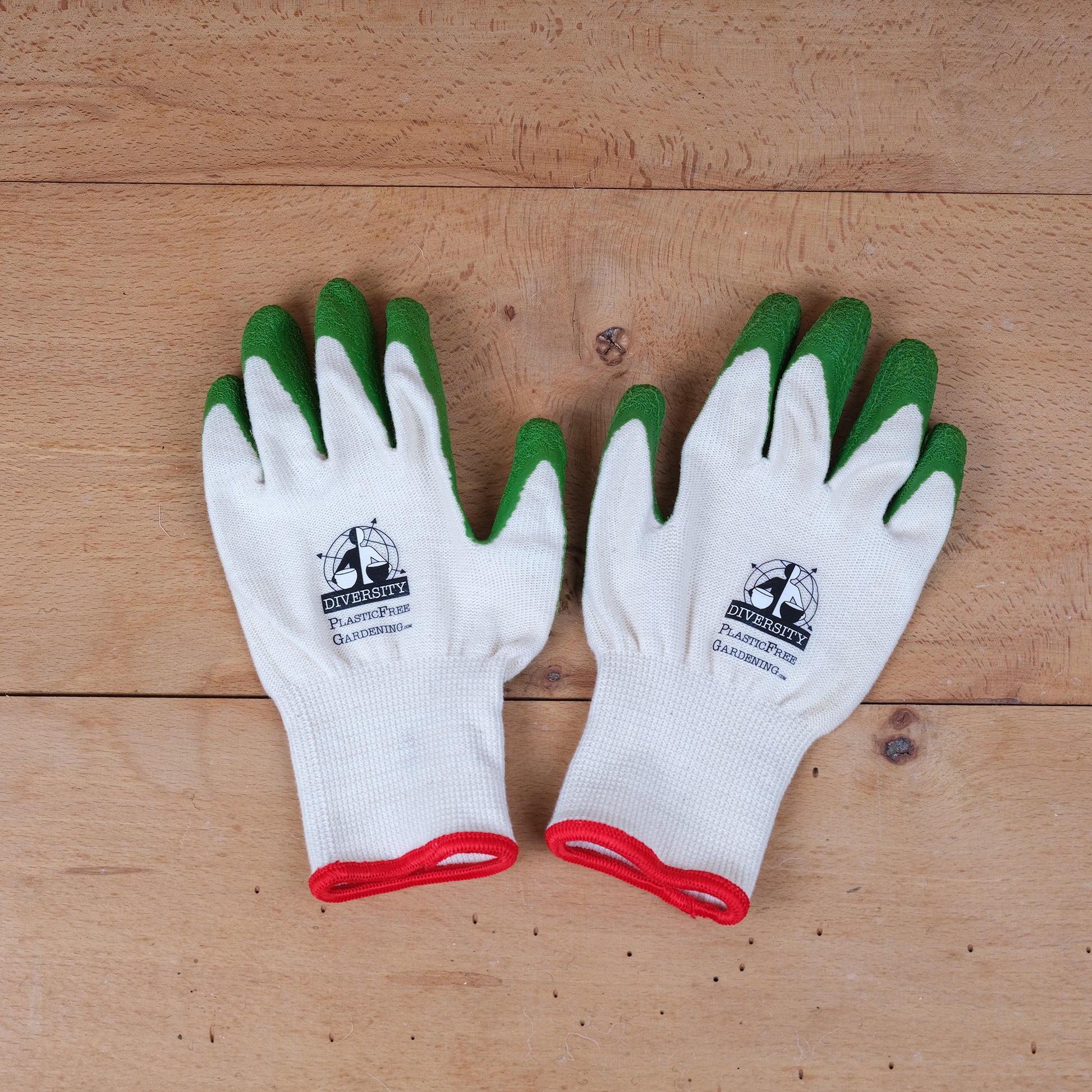 Cream coloured organic cotton gardening gloves with green FSC certified, fair trade natural rubber grips.