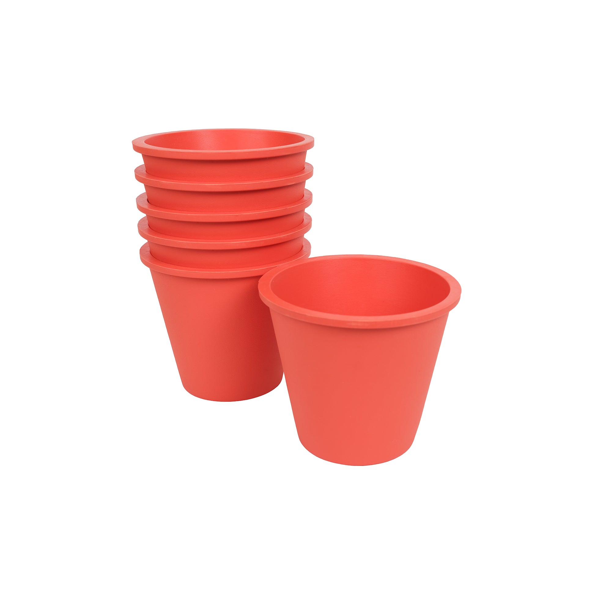 Six coral, plastic free plant pots made from FSC certified, fair trade natural rubber.