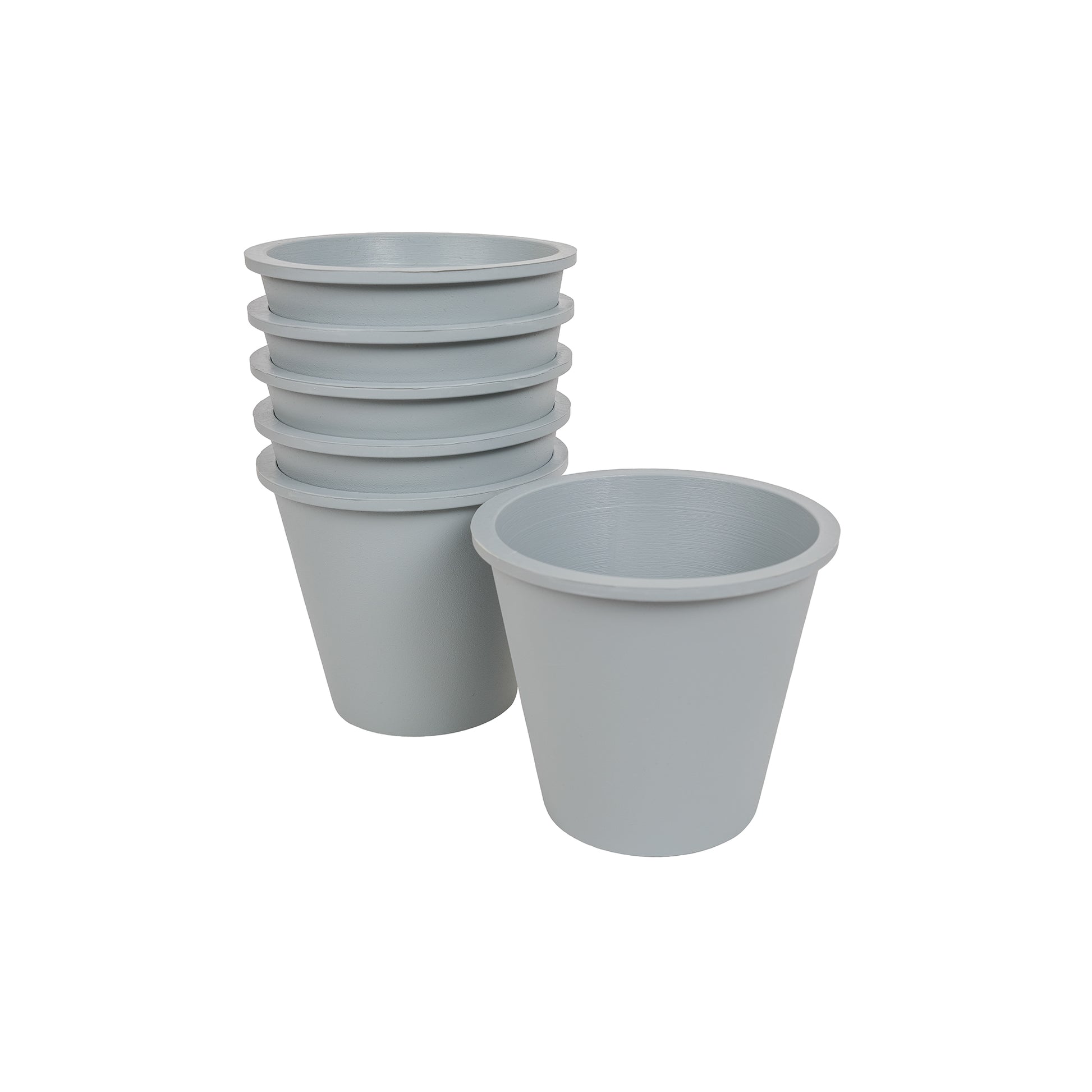 Six grey, plastic free plant pots made from FSC certified, fair trade natural rubber.