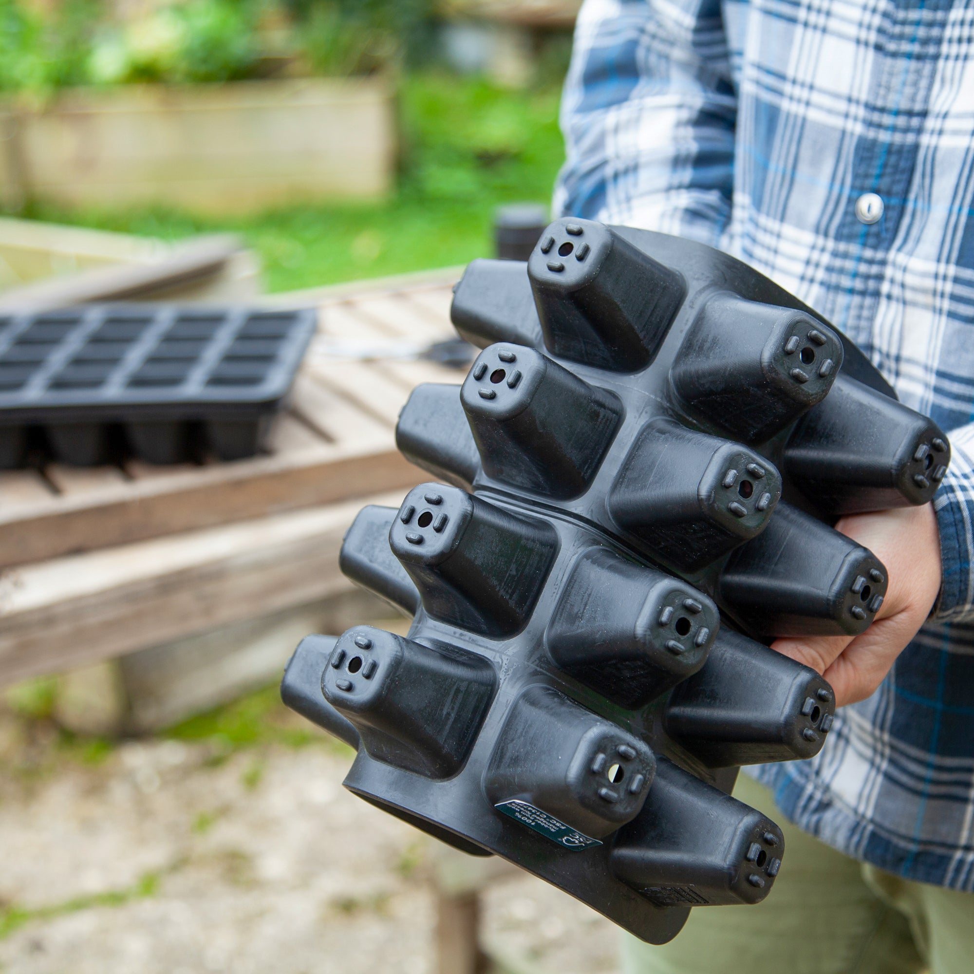 Black, plastic free, twenty cell seed tray made of FSC certified, fair trade natural rubber.