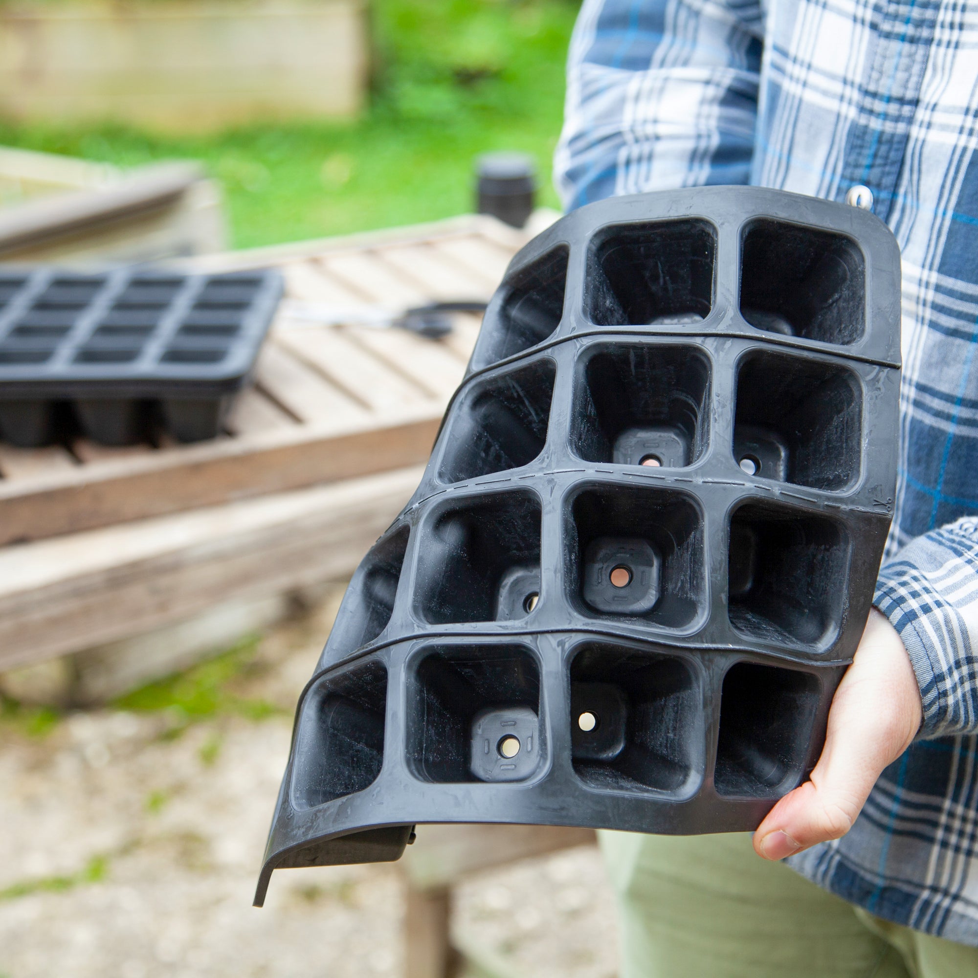 Black, plastic free, twenty cell seed tray made of FSC certified, fair trade natural rubber.
