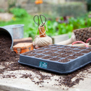 Black, plastic free, thirty cell seed tray with small cells made of FSC certified, fair trade natural rubber.