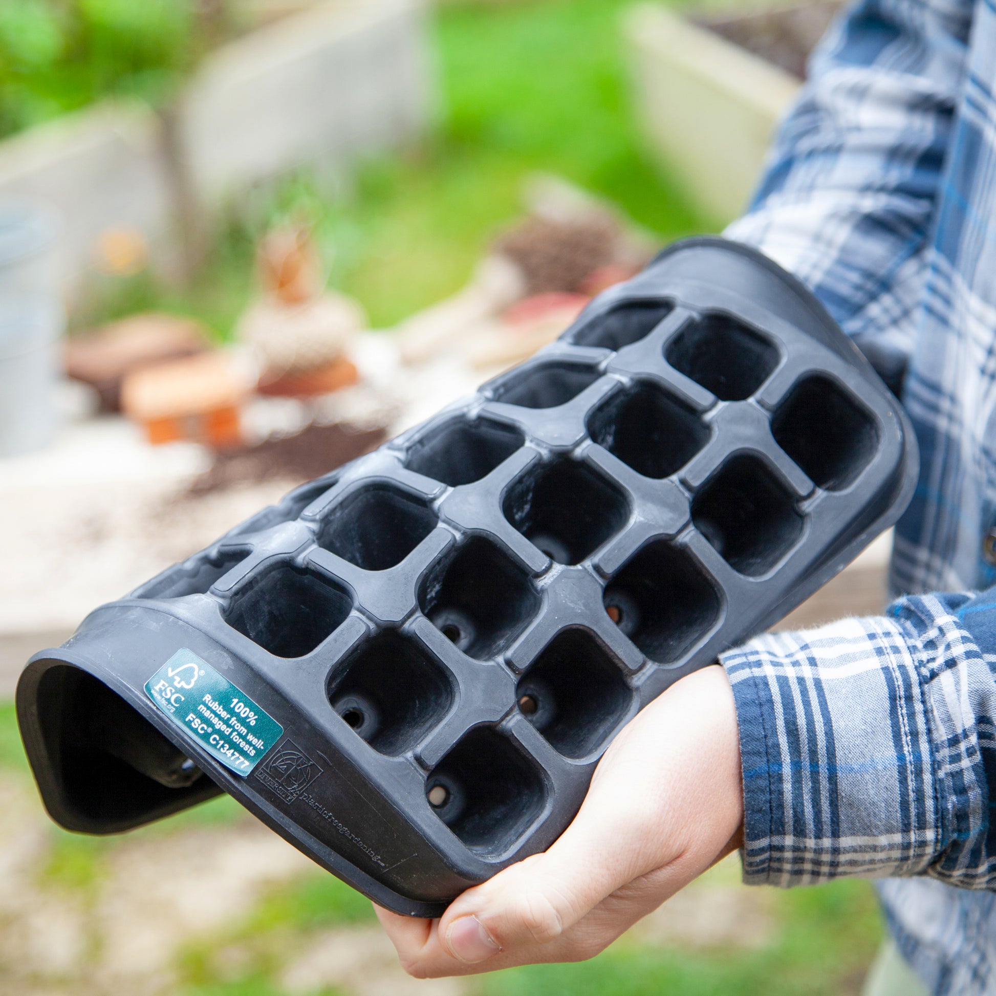 Black, plastic free, thirty cell seed tray with small cells made of FSC certified, fair trade natural rubber.