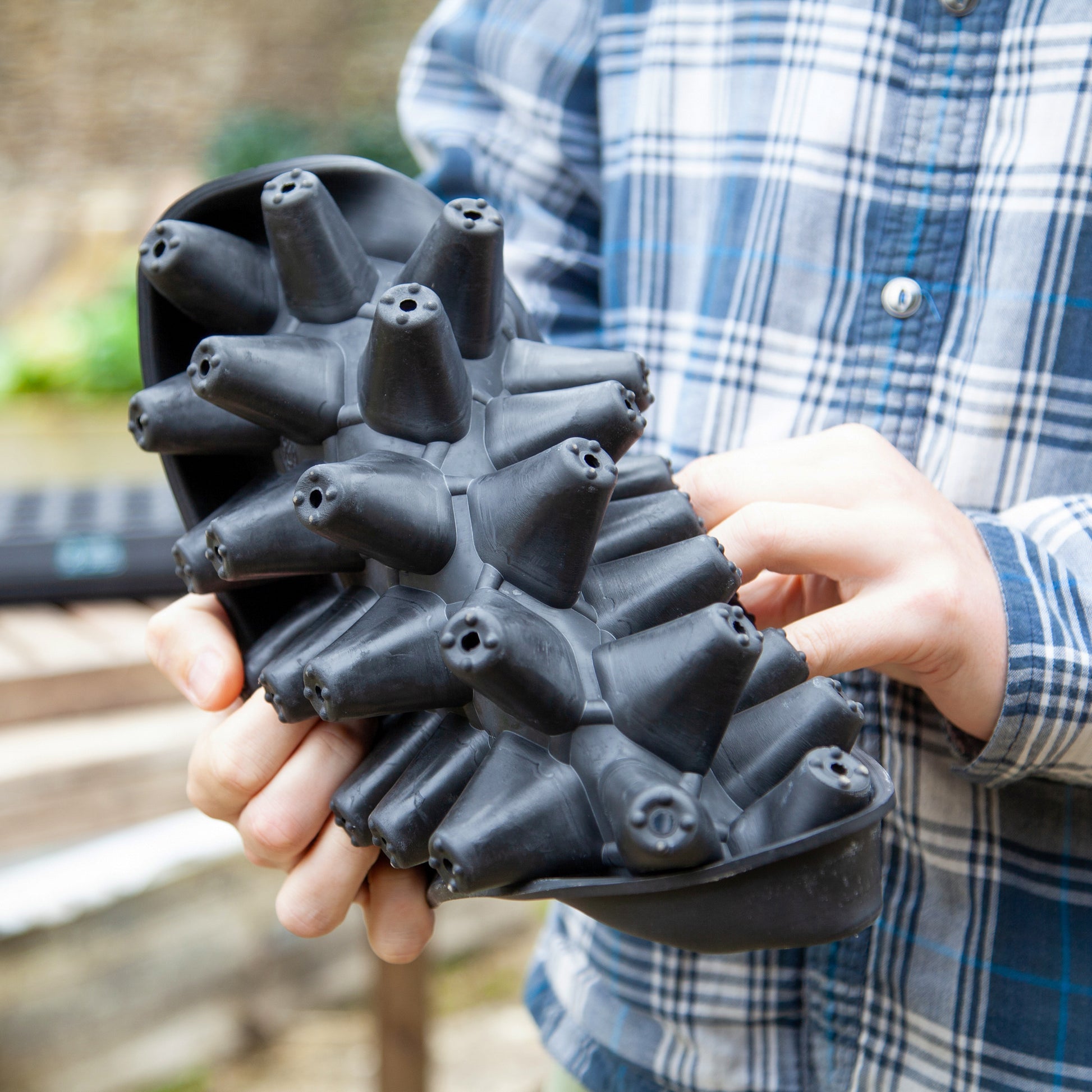 Black, plastic free, thirty cell seed tray with small cells made of FSC certified, fair trade natural rubber.