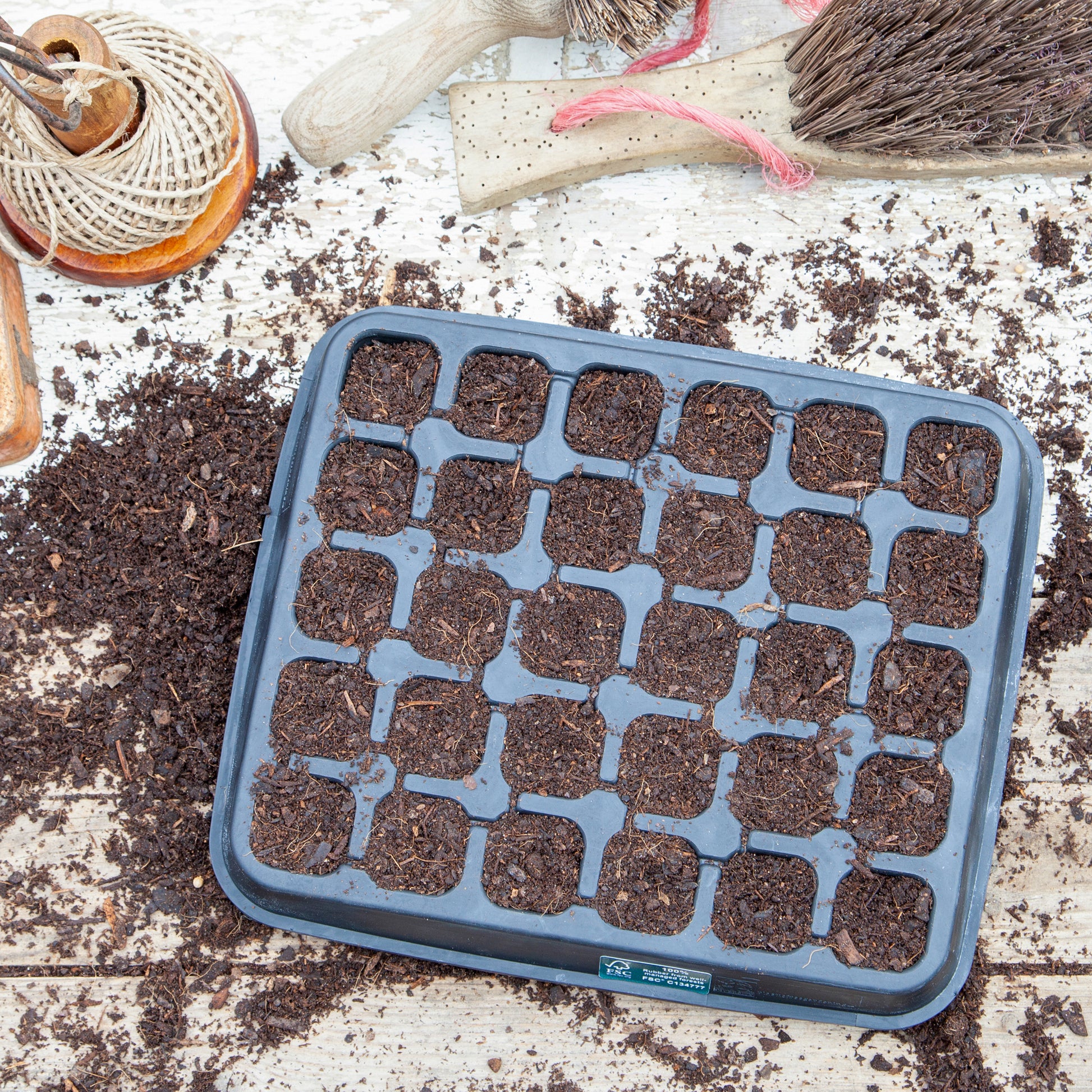 Black, plastic free, thirty cell seed tray with small cells made of FSC certified, fair trade natural rubber.