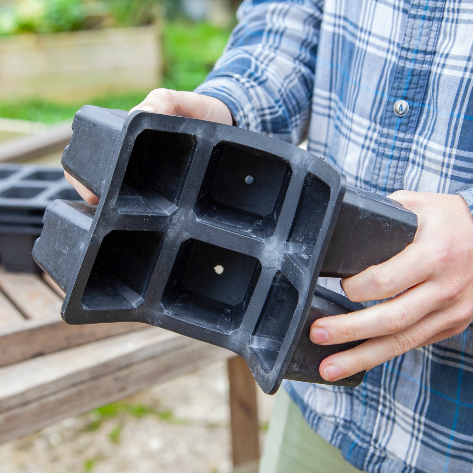 Black, plastic free, six cell seed tray with extra large cells made of FSC certified, fair trade natural rubber.
