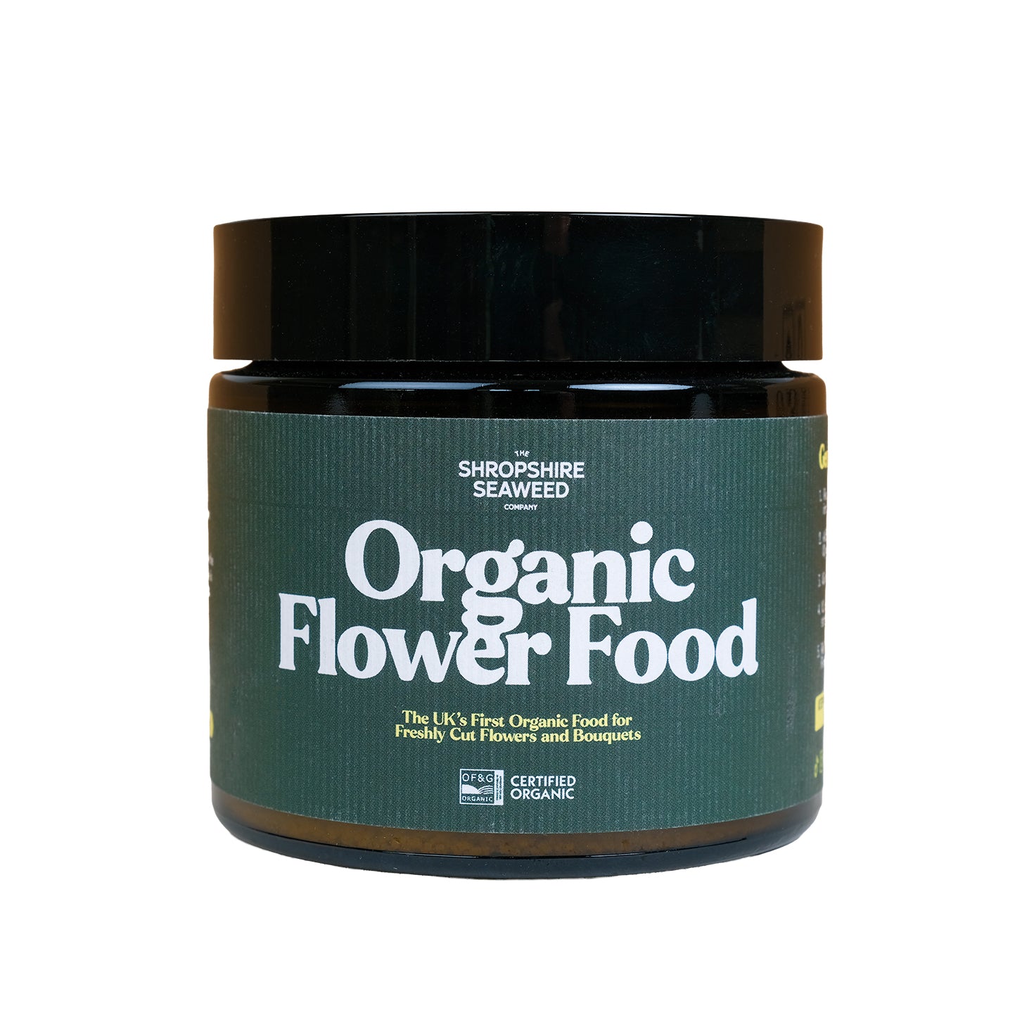 A glass jar of organic cut flower food.