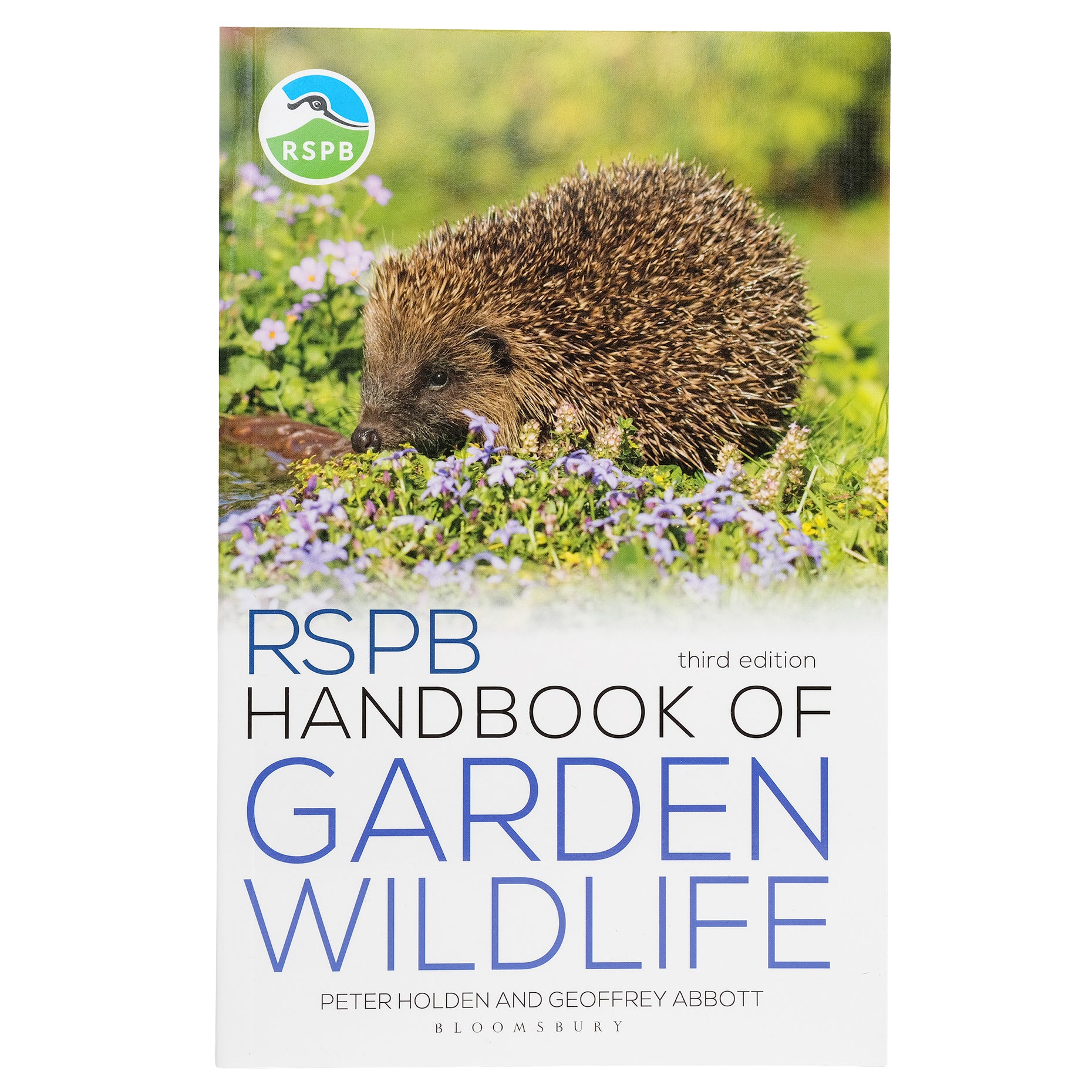 Book cover of RSPB Handbook of Garden Wildlife with a picture of a hedgehog amongst flowers.