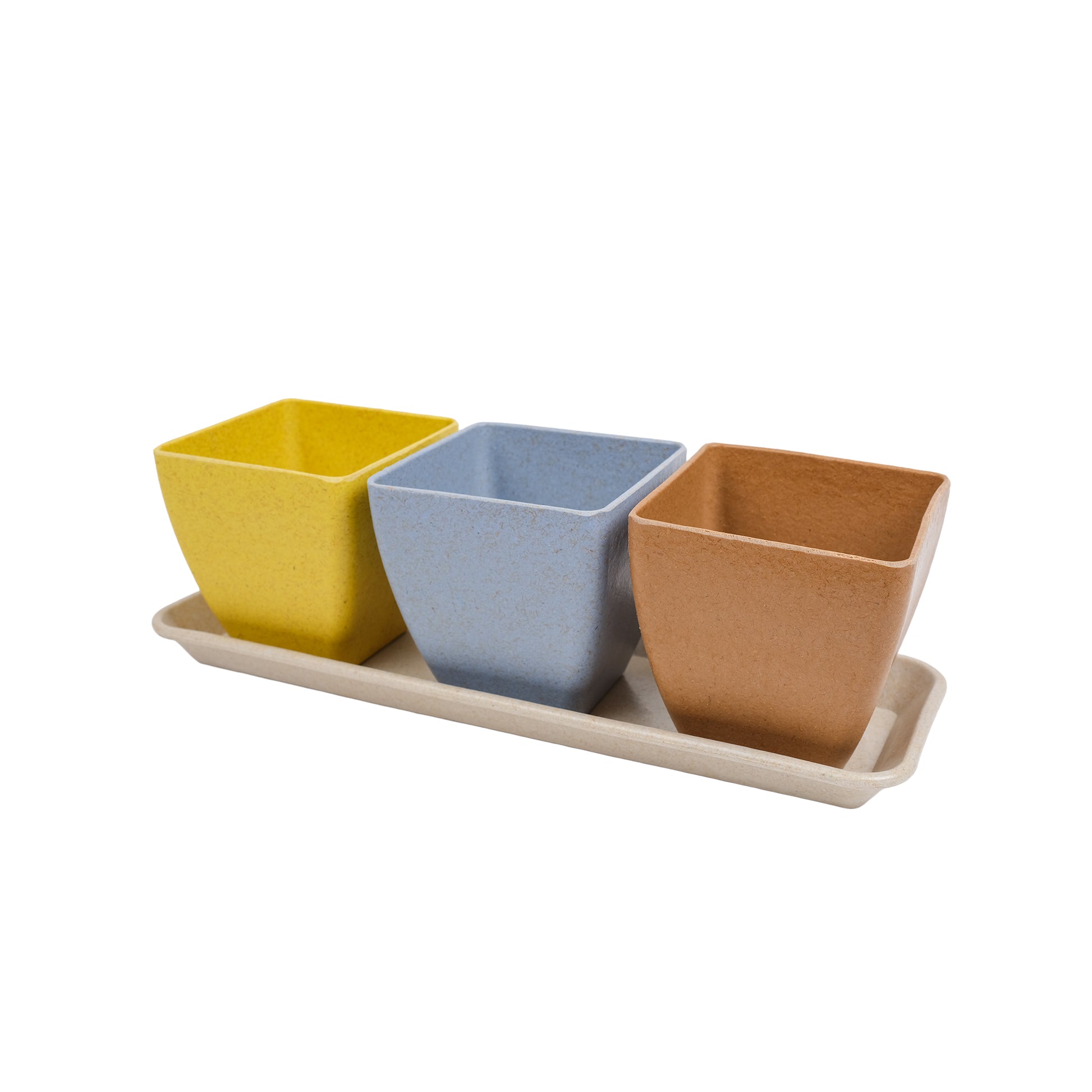 Set of three pots with a saucer, designed for a windowsill. The pots are yellow, blue and brown.