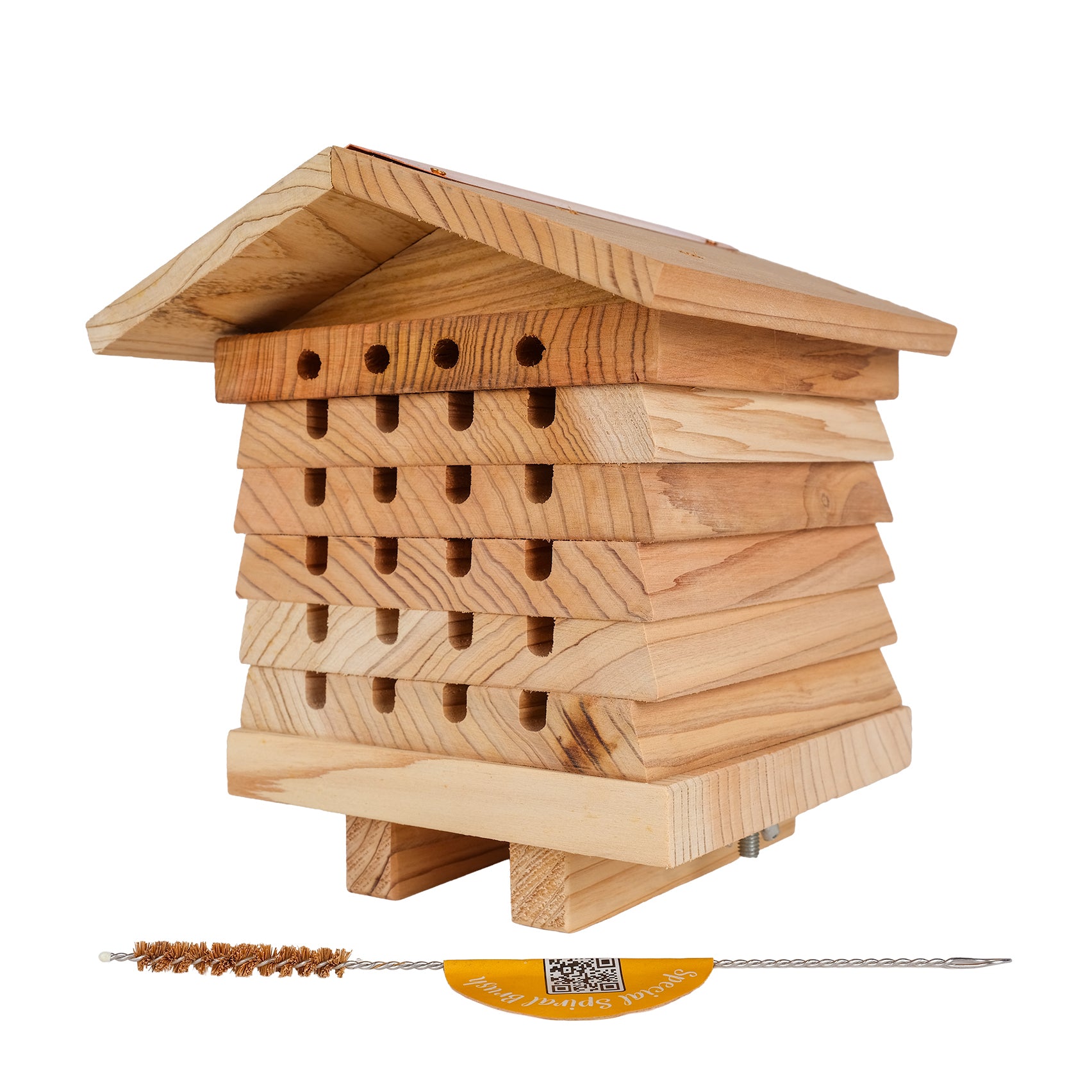 Wooden solitary bee hive with natural bristle and wire brush.