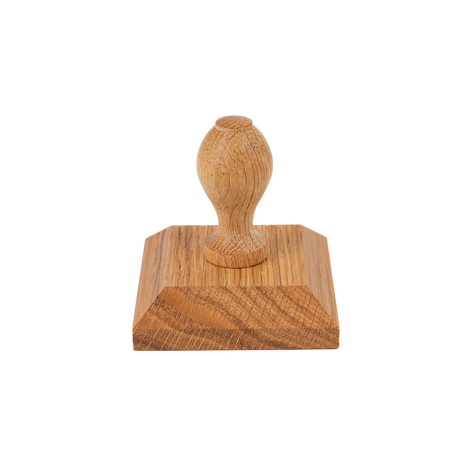 Square, wooden seed tray tamper.