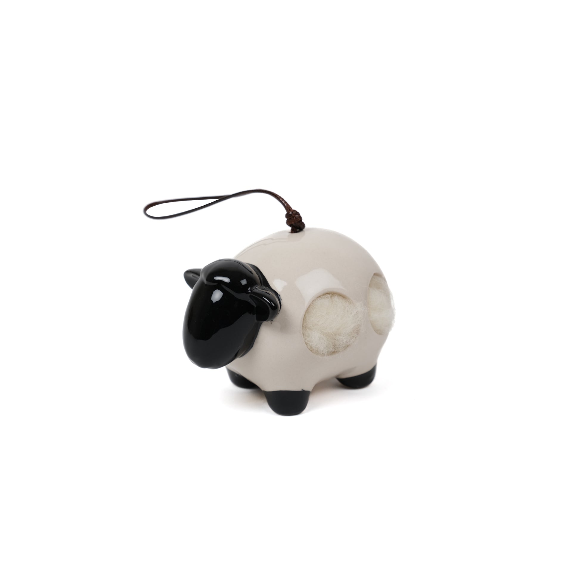 Ceramic ‘Woolie’ the sheep hanging nesting wool dispenser for birds.